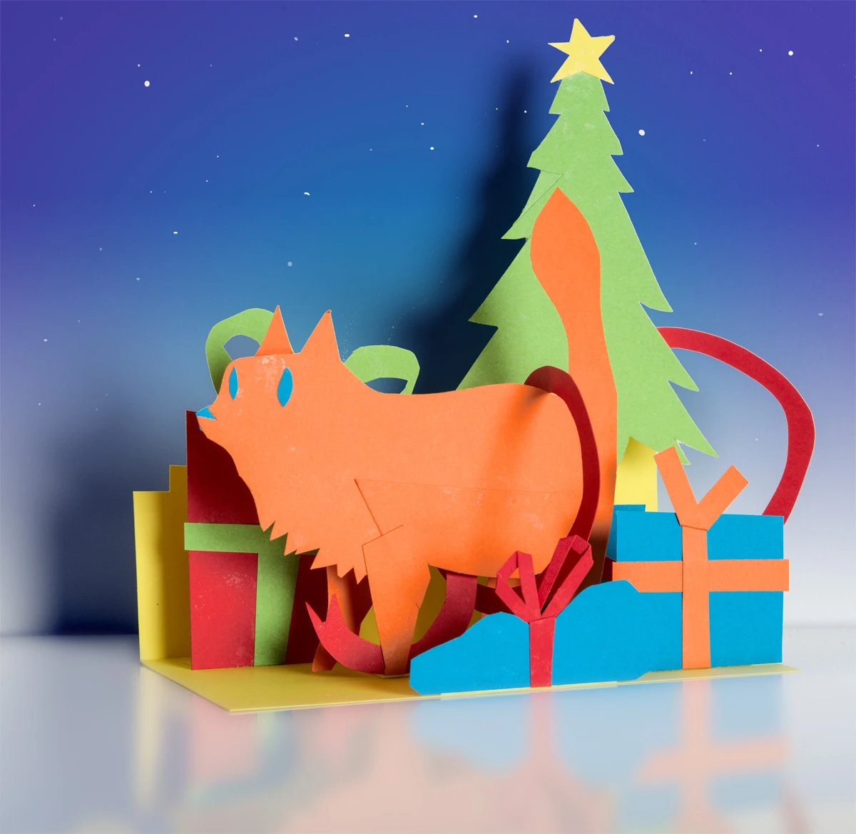 Christmas cat will help open presents. Cut paper diorama